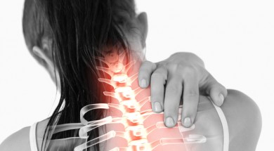 Digital composite of Highlighted spine of woman with neck pain