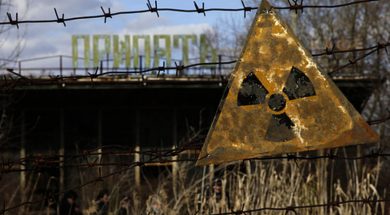 A radioactive sign hangs on barbed wire outside a café in Pripyat.